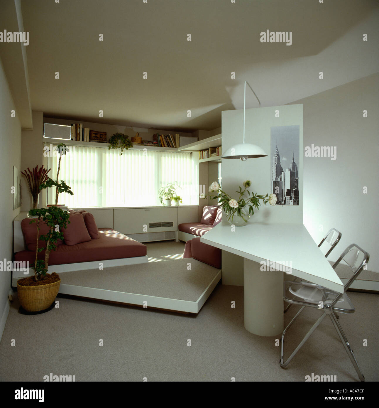 White Triangular Table And Raised Floor In Eighties Study Bedroom With Grey Carpet Stock Photo Alamy
