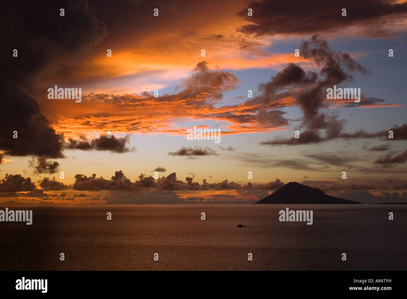Sunset colors over Manado Tua, North Sulawesi Indonesia. Stock Photo