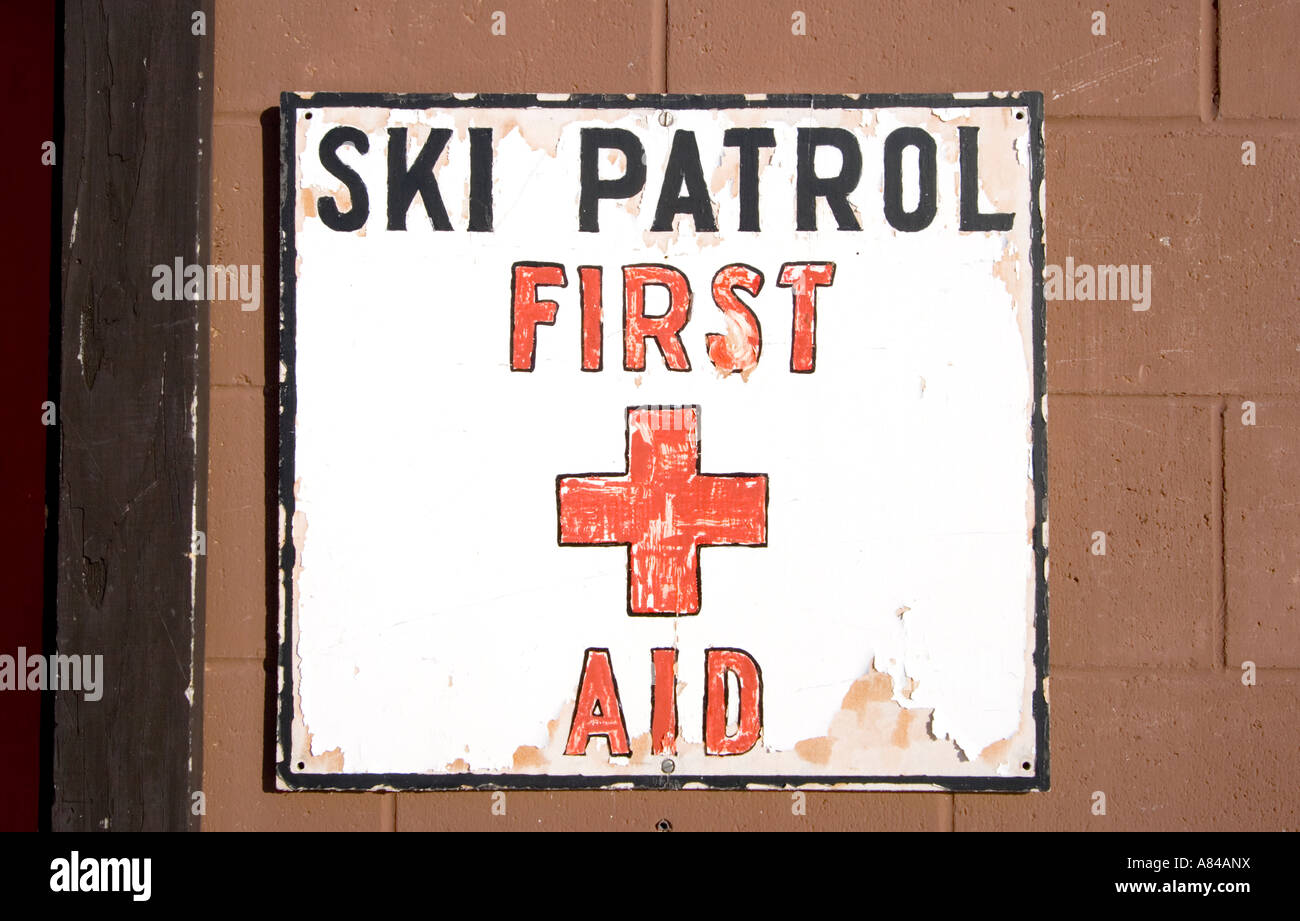 Well worn ski patrol first aid sign outside the rescue station. Blackjack Ski Resort Bessemer Michigan USA Stock Photo