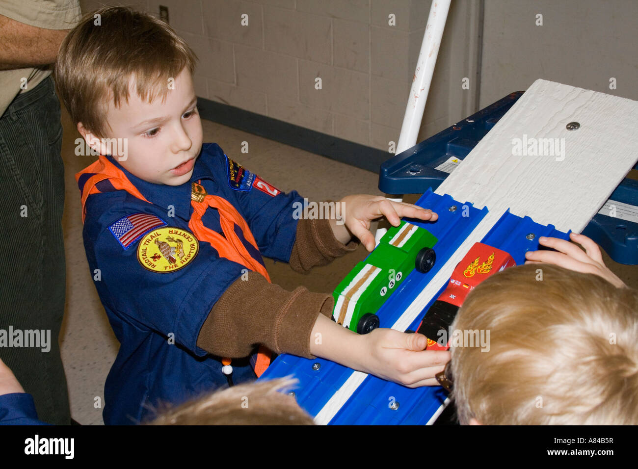Cub Scout age 7 starting race cars for Pinewood Derby. Horace Mann Elementary School 'St Paul' Minnesota USA Stock Photo