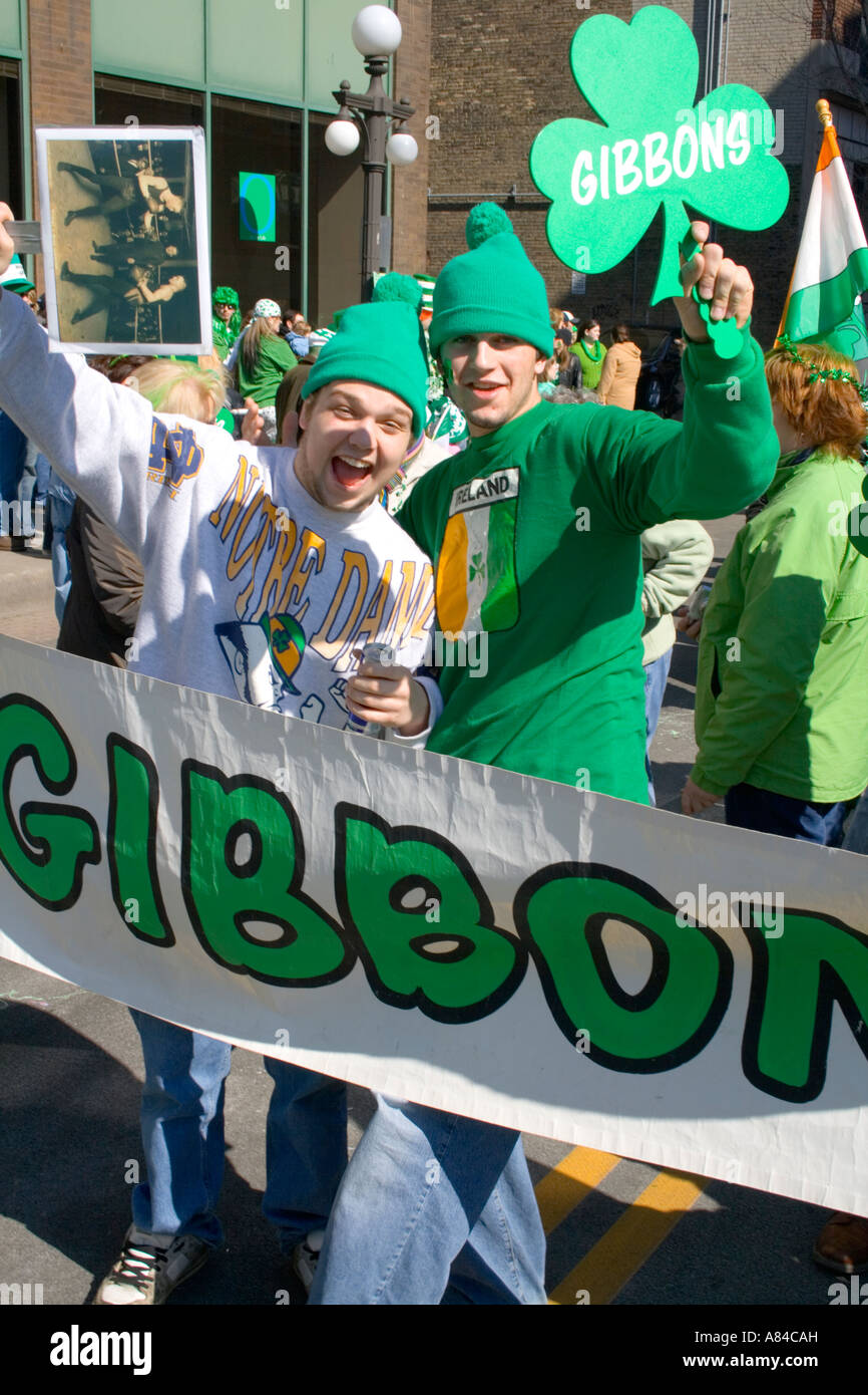 Gibbons Clan revelers age 21 marching behind banner. St Patrick's Day