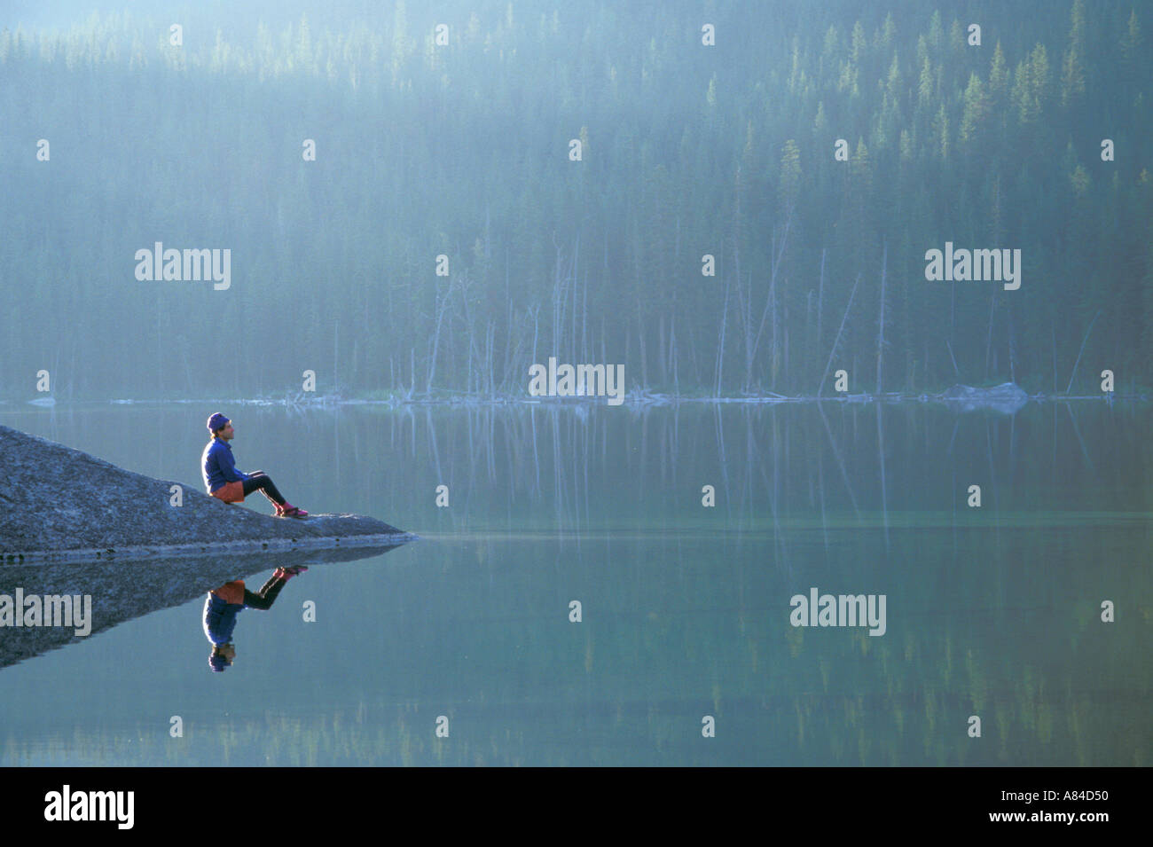 Man sitting on lake hi-res stock photography and images - Alamy