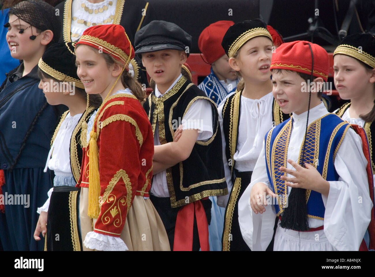 Australian children of Greek descent celebrate at a festival in traditional costume Stock Photo