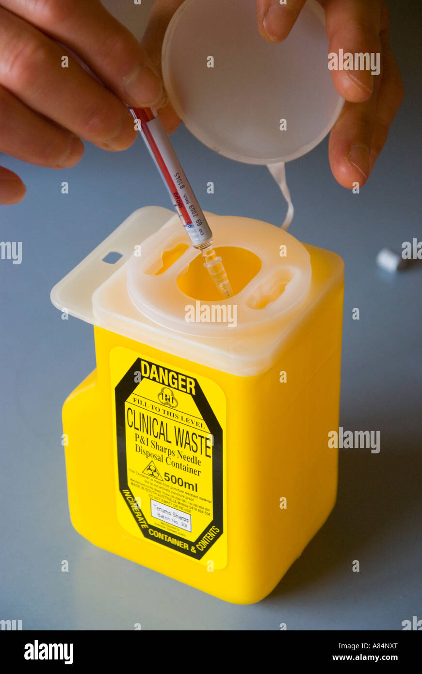Disposing of a single use hypodermic needle in a clinical waste