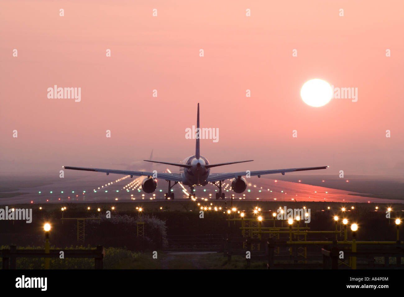 Aeroplane awaiting takeoff on runway. Stock Photo