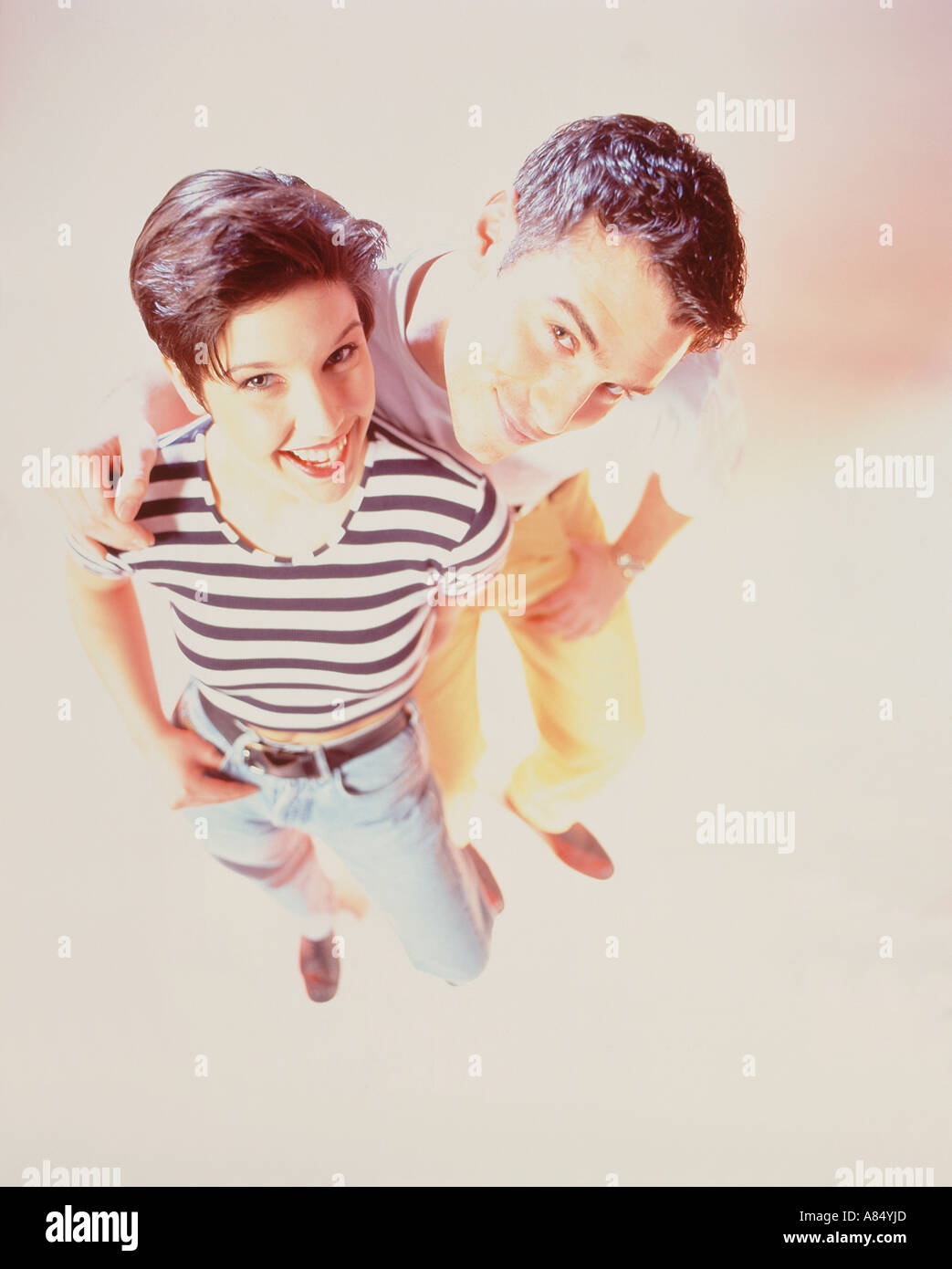 High viewpoint studio image of young couple. Stock Photo