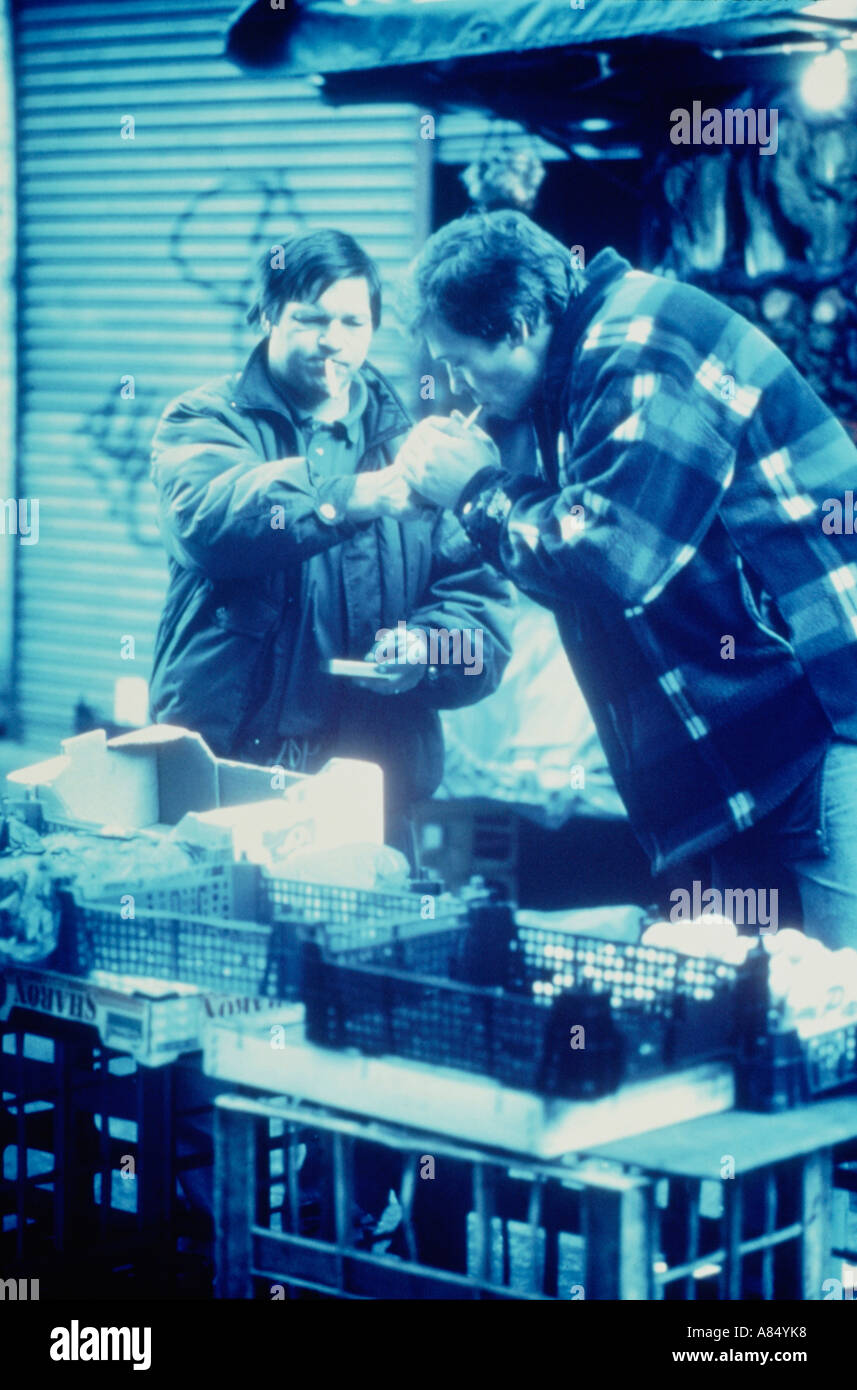 UK. England. London. Market traders. Two men smoking. Stock Photo