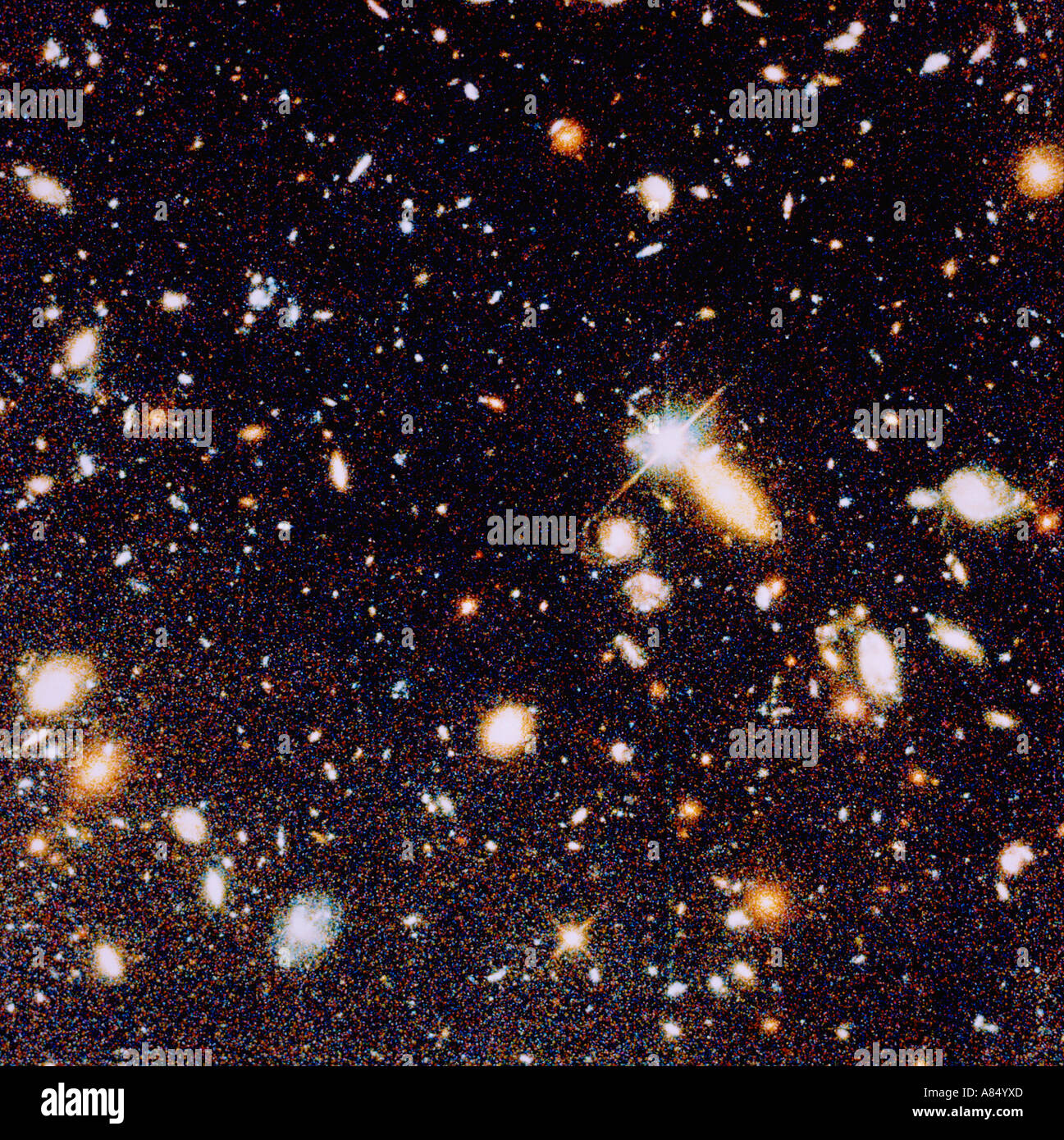 Space and astronomy. Hubble telescope image. Deep view of the Universe showing the earliest formed galaxies. Stock Photo