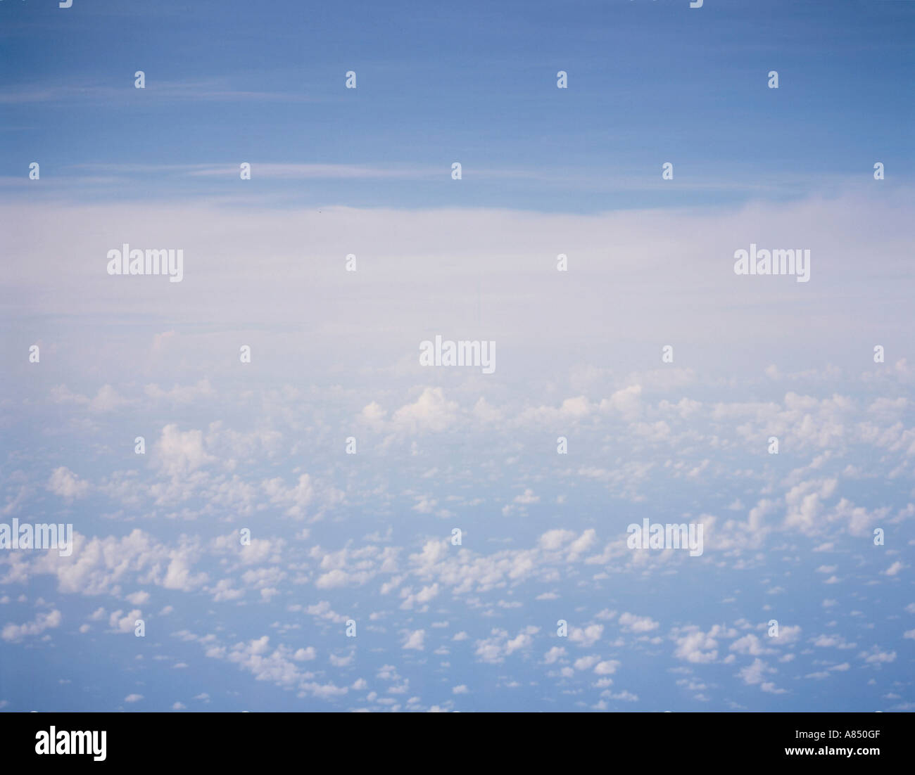 Aerial view of blue sky above the clouds. Stock Photo