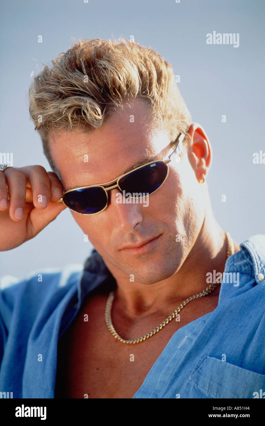 Man wearing shirt sunglasses hi-res stock photography and images - Alamy