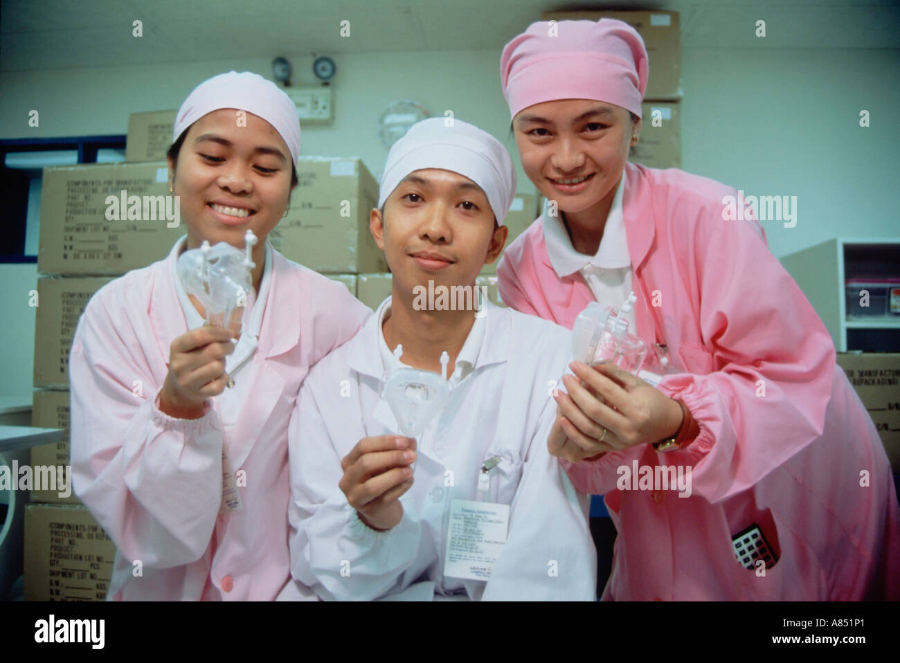 Philippines. Plastics manufacturing. Three laboratory technicians in