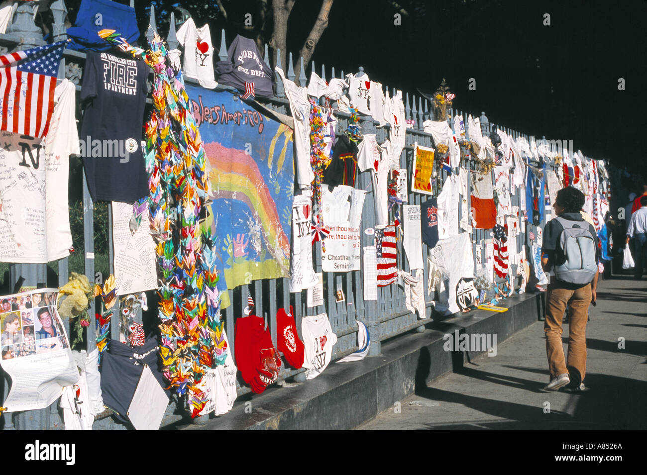 Person Viewing Memorial Wall/Fence Stock Photo