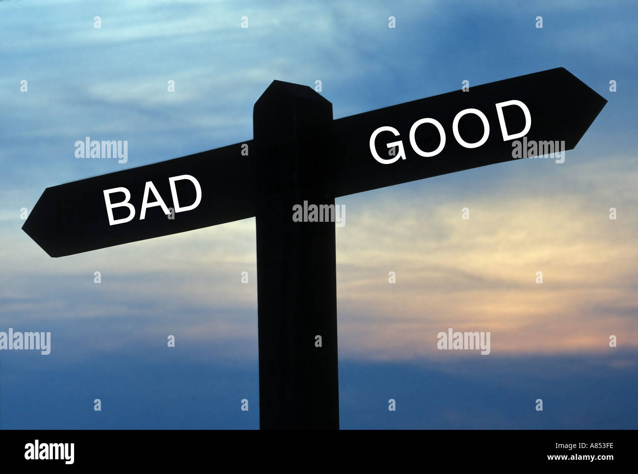 signpost with good and bad directions Stock Photo