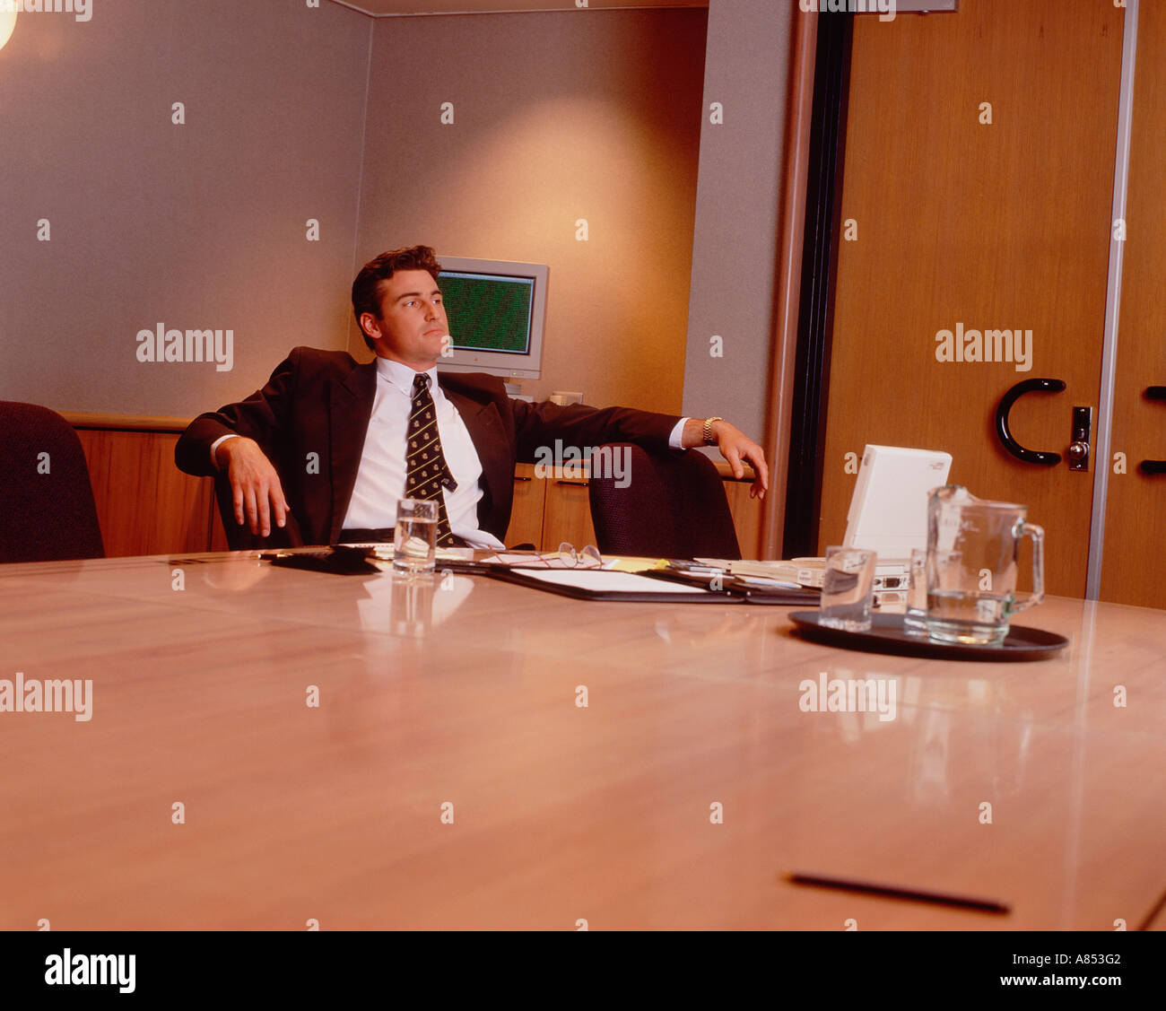Thoughtful business man alone in office. Stock Photo