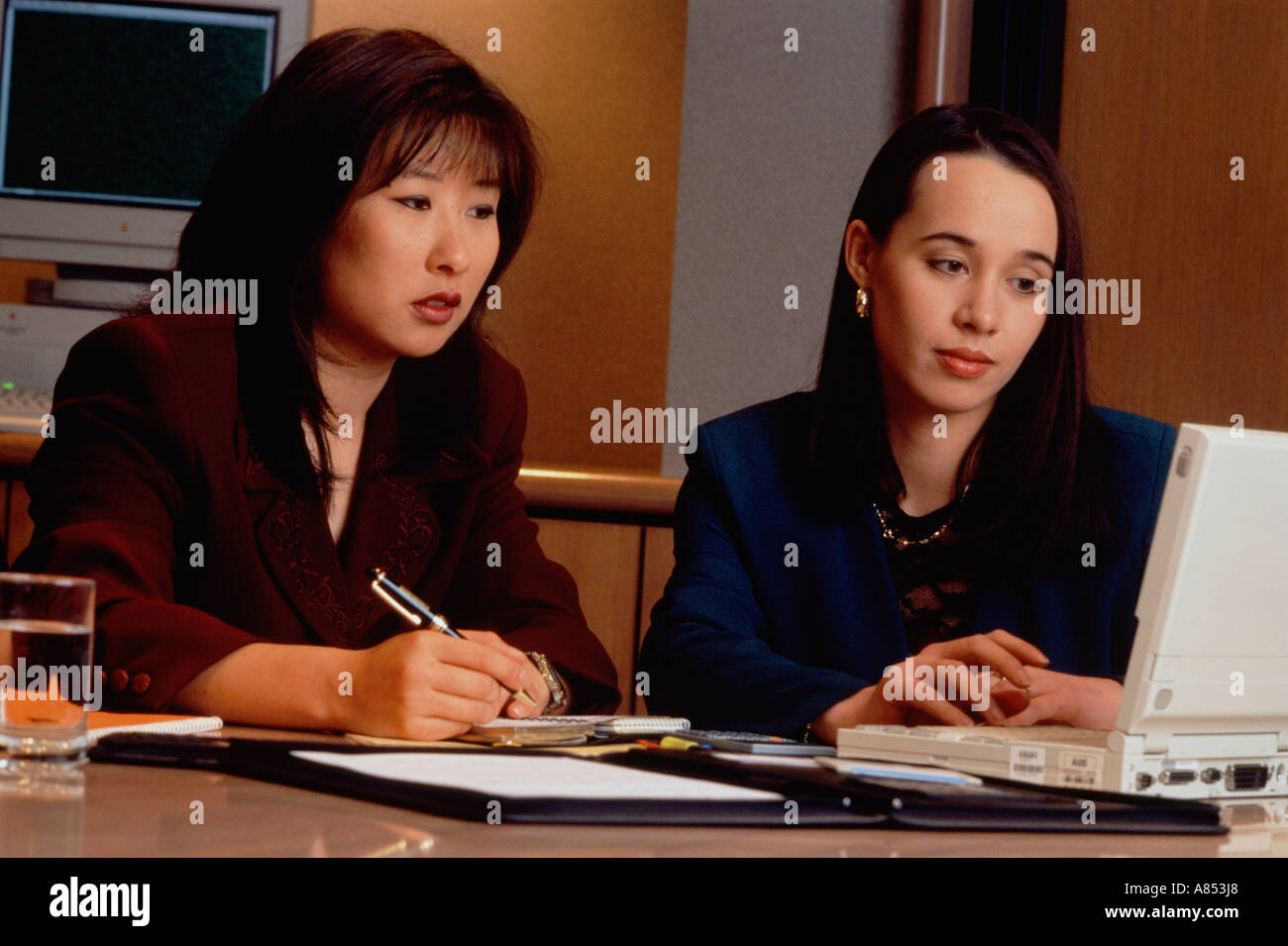 Closeup if  two women working in an office. Stock Photo