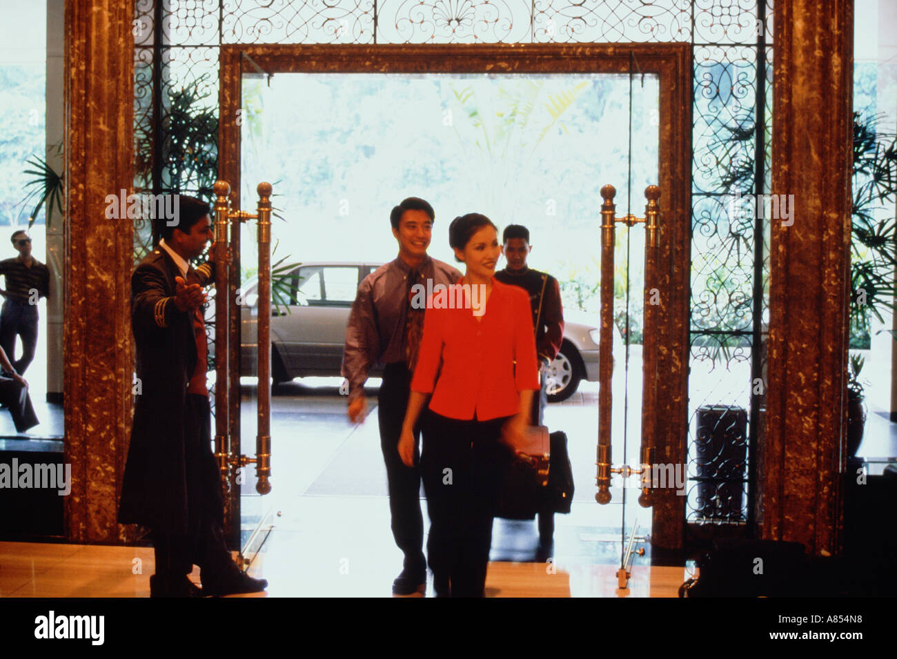 Staff greeting guests in hotel hi-res stock photography and images - Alamy