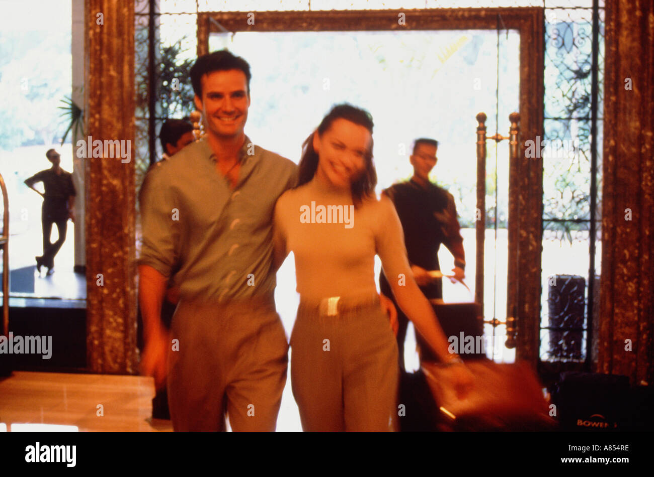 Young couple in hotel lobby. Stock Photo