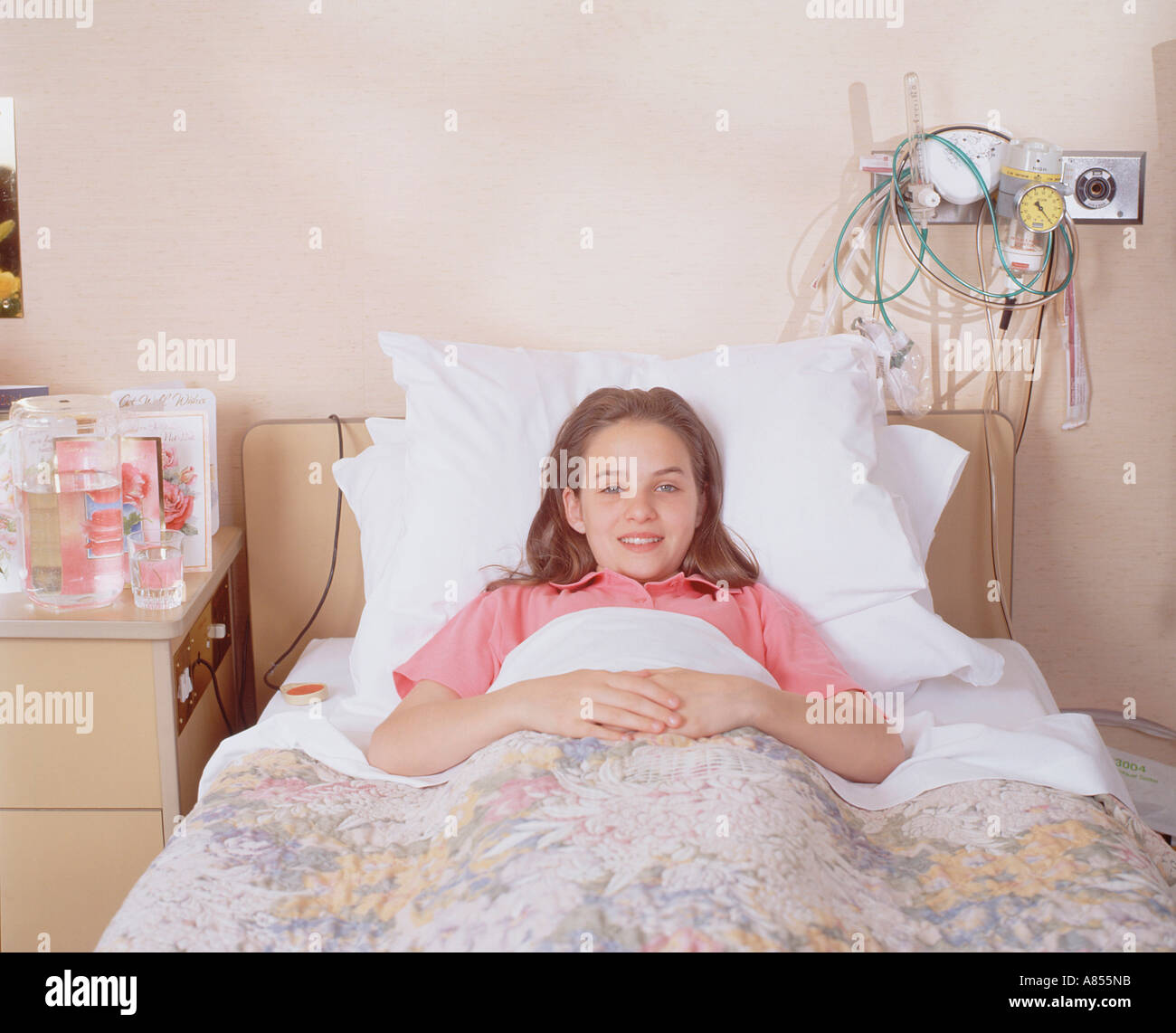 Hospital Paediatrics unit. Young girl child patient in bed. Stock Photo