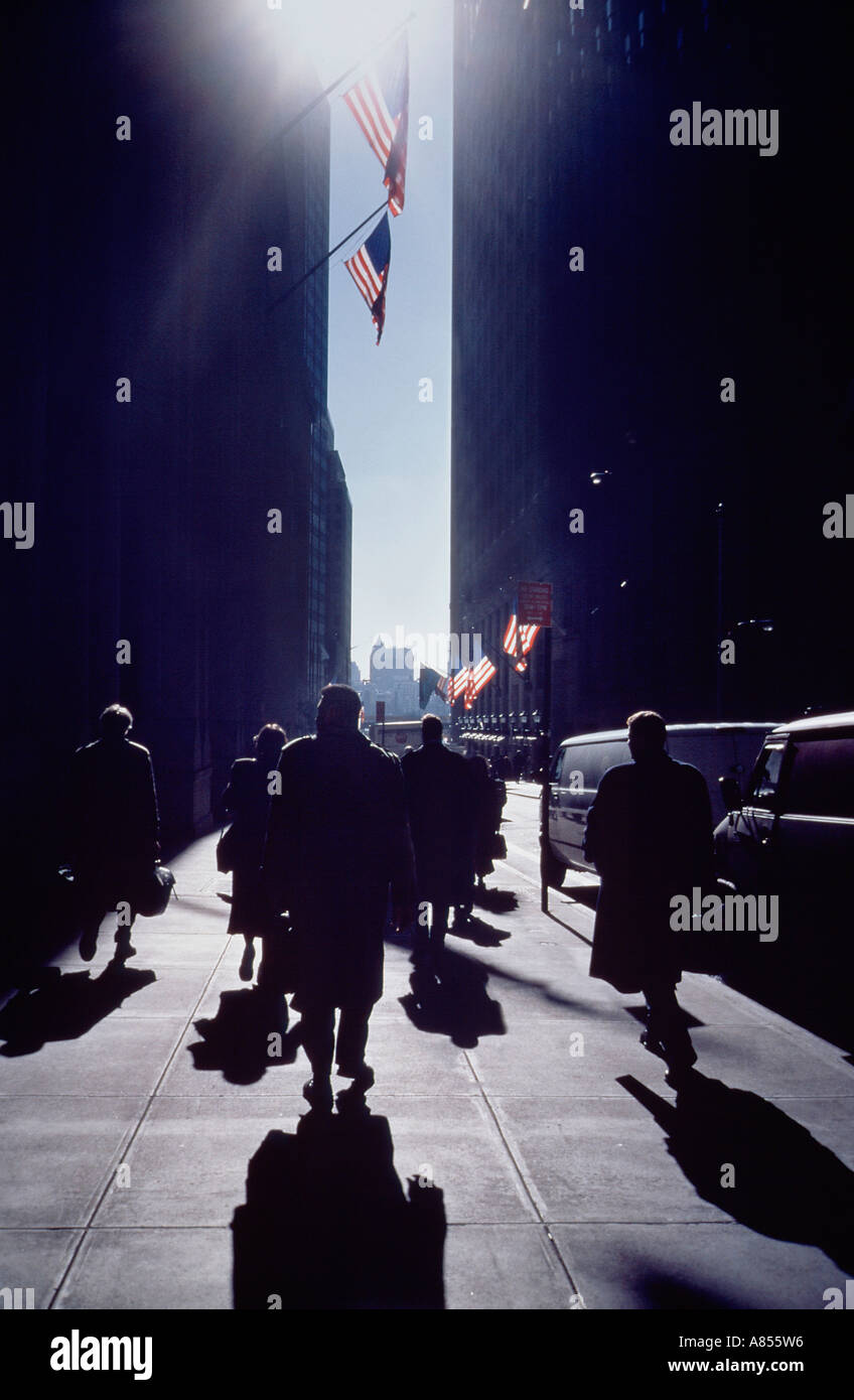 United States of America. New York city. Silhouette of people walking in Wall Street. Stock Photo