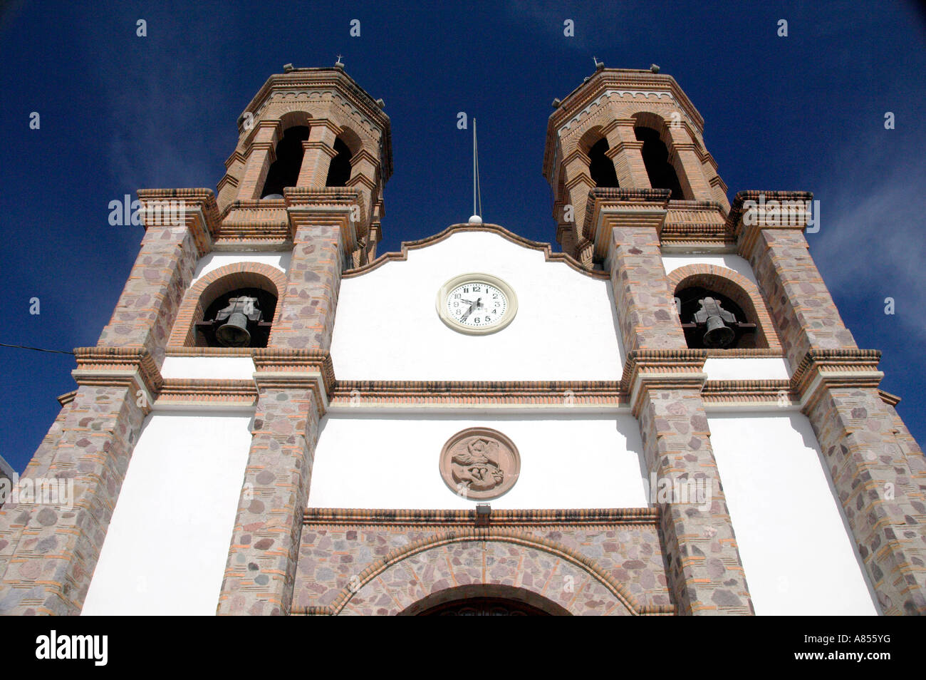 The bell towers of the Church of San Miguel Archangel in El Pitillal near Puerto Vallarta Mexico Stock Photo