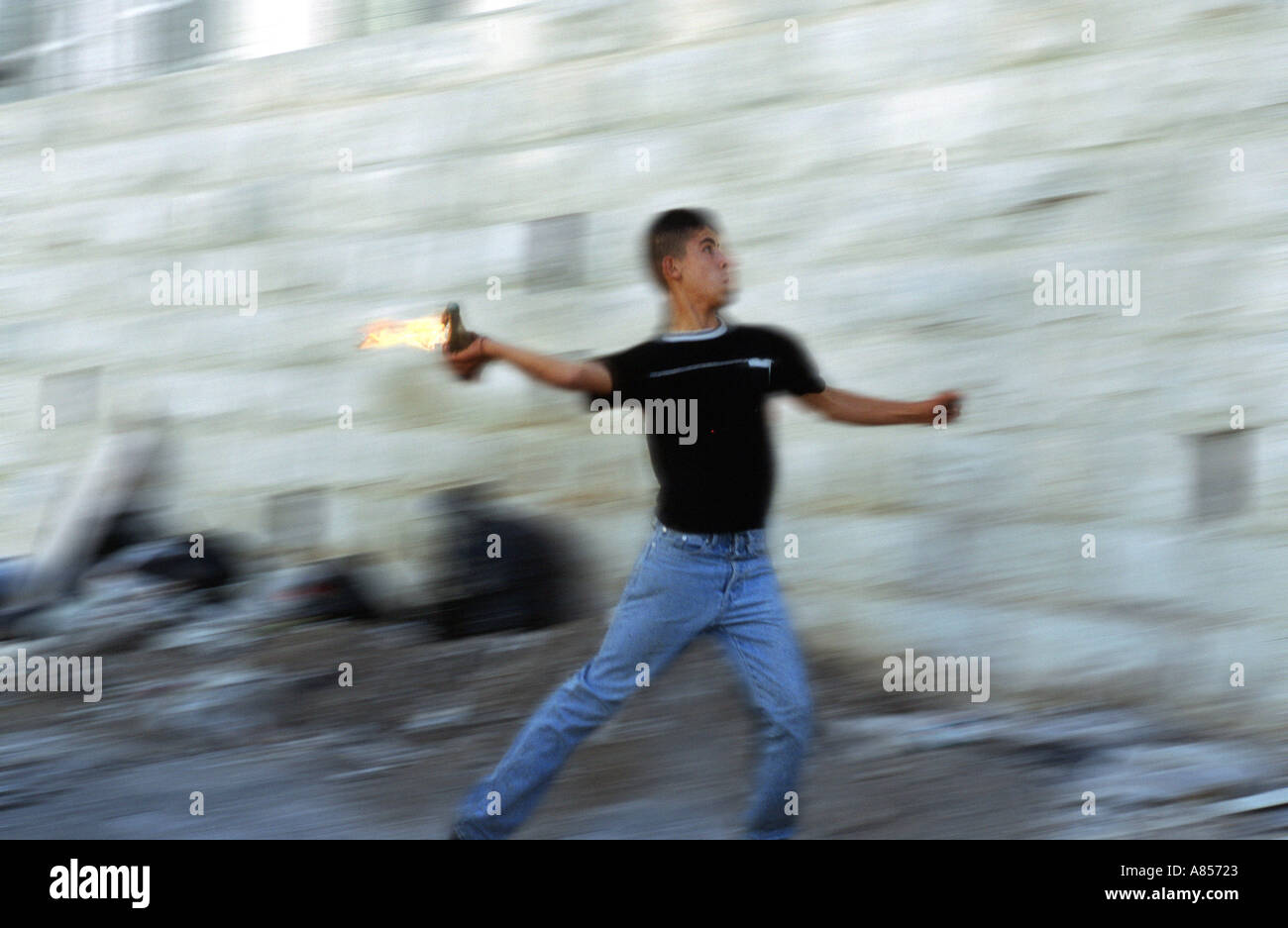 A teen throwing a molotof Nablus November 2002  Stock Photo