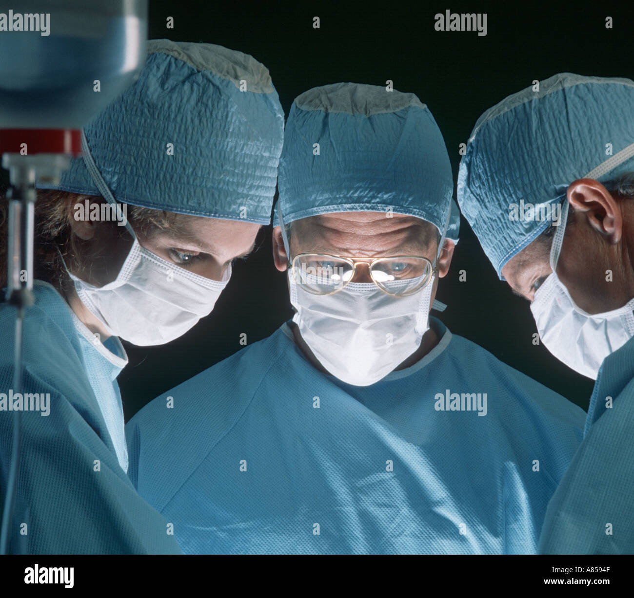 surgeons operating on patient Stock Photo