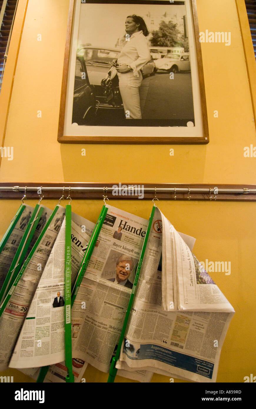 Detail of newspaper rack and decor inside famous Cafe Einstein in Unter den Linden Berlin Stock Photo