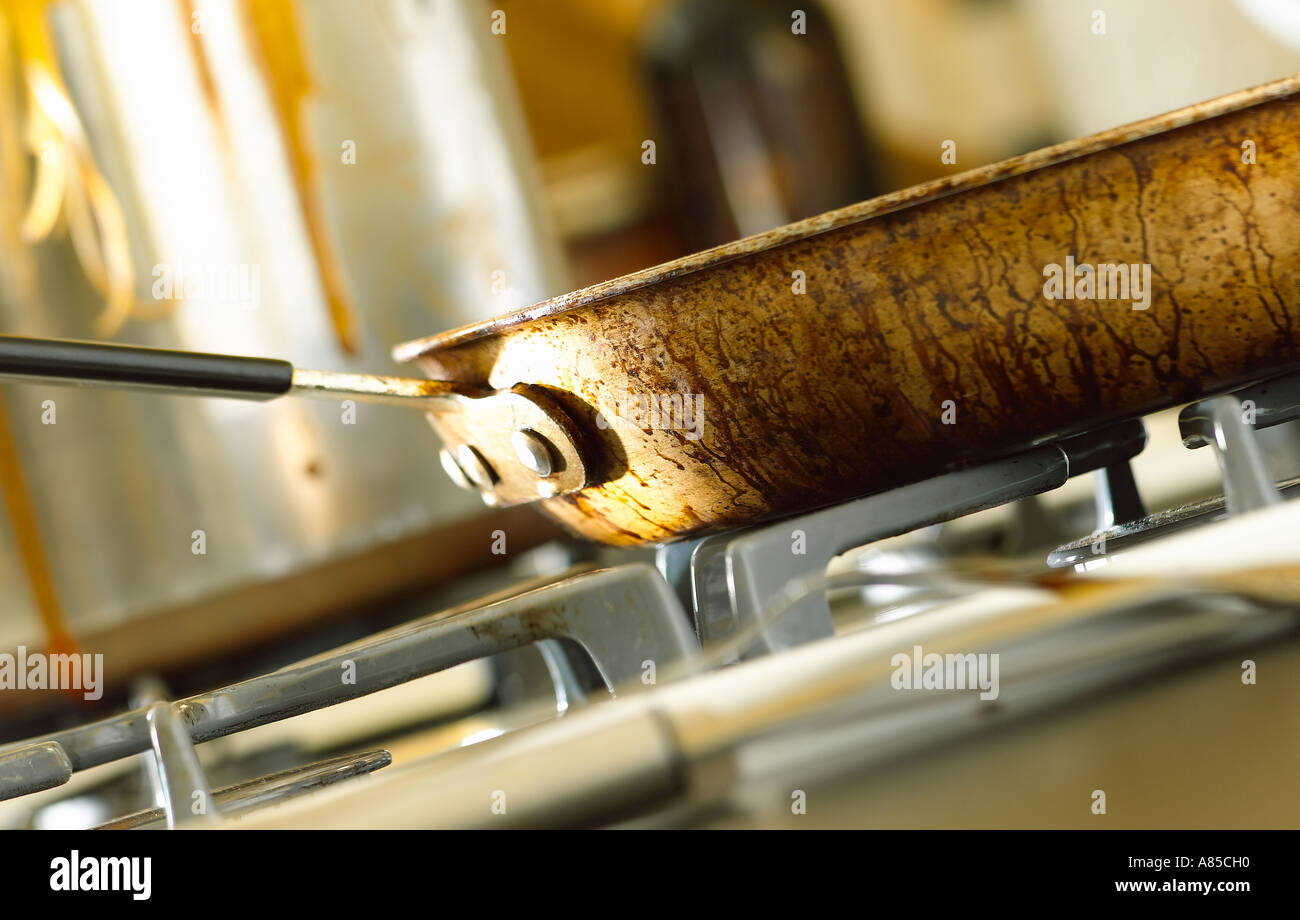 frying pan on top of stove Stock Photo Alamy