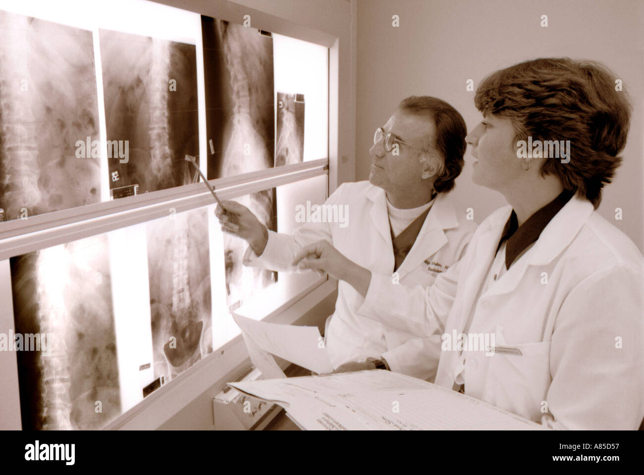Doctor reviewing x rays in hospital hi-res stock photography and images ...