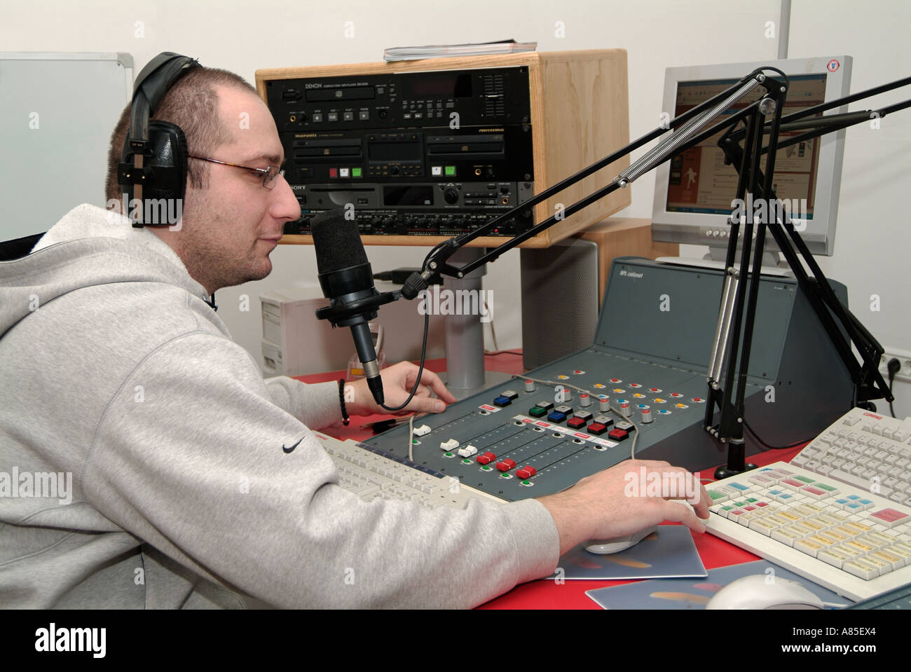 Radio DJ in an On Air Studio Presenting His Show Stock Photo - Alamy