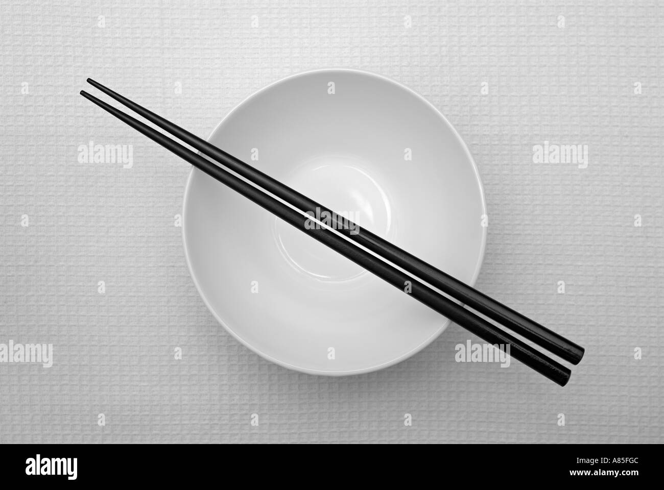 Empty White Rice Bowl With Chopsticks Stock Photo