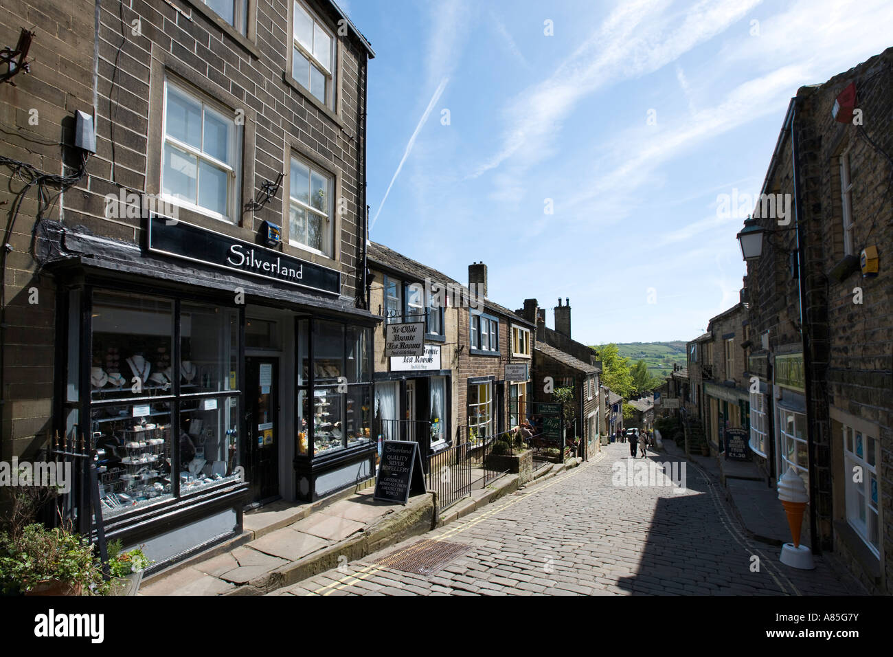 Shops on the main street in the village centre, Haworth, West Yorkshire, England, UK Stock Photo