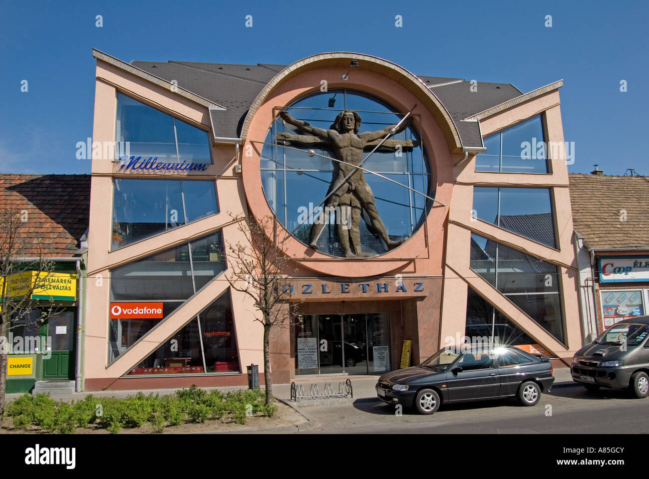 Komarom, Western Transdanubia, Hungary. Modern commercial building with Leonardo's 'vitruvian man' on facade Stock Photo