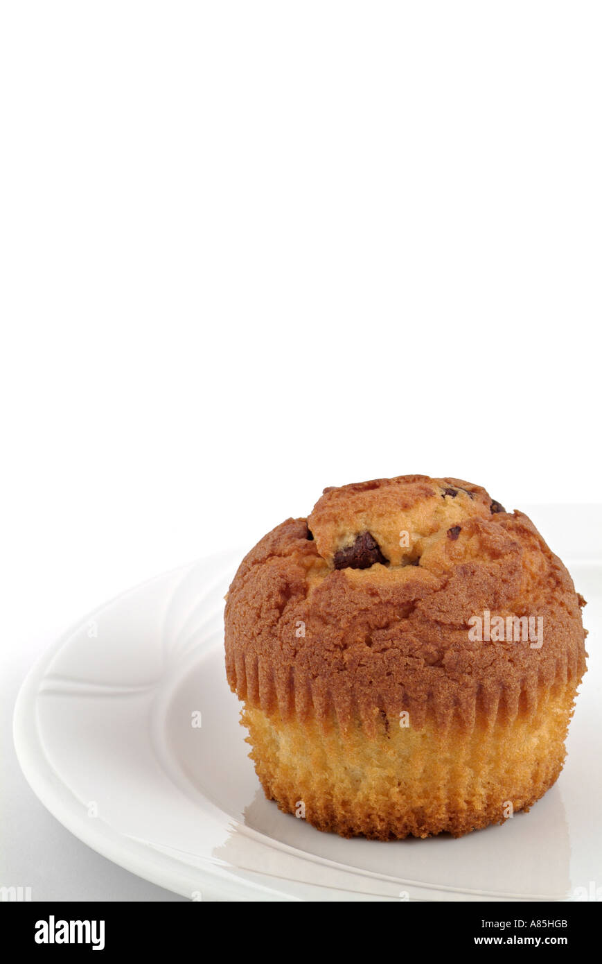 Chocolate Chip Muffin Against A White Background Stock Photo