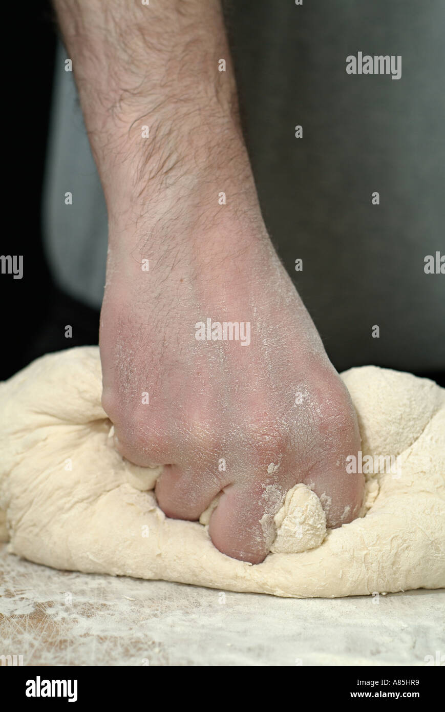 Male Kneading Bread Dough for Baking Stock Photo