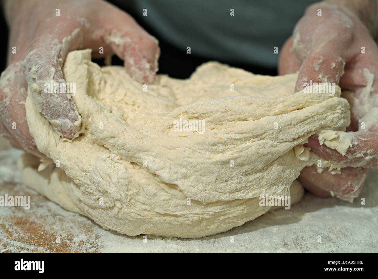 Baker Kneading Bread Dough Stock Photo