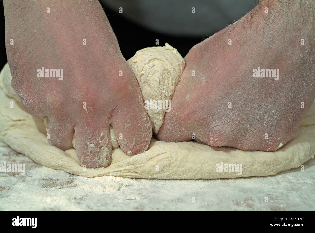 Male Kneading Bread Dough for Baking Stock Photo