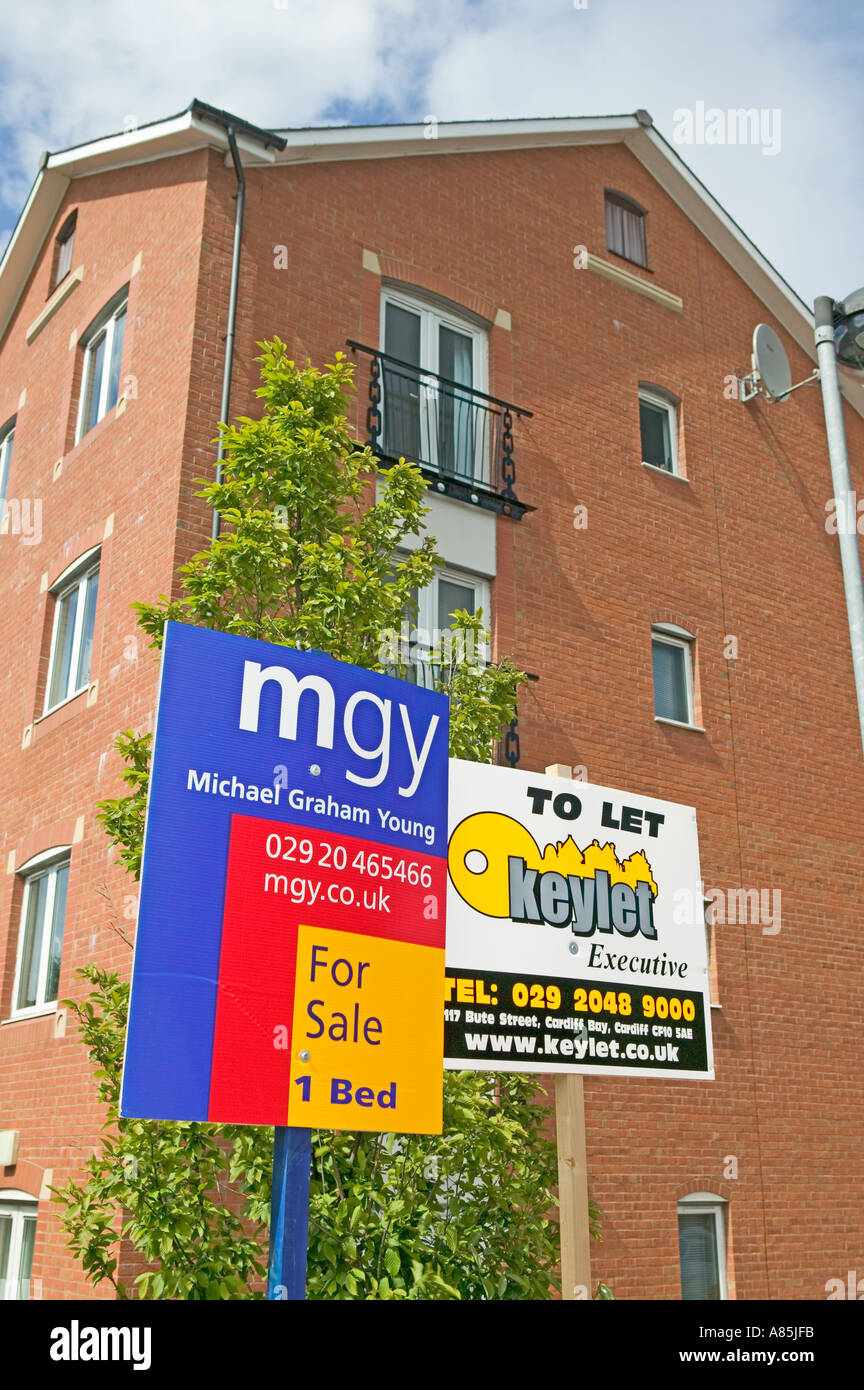 Estate agent for sale and rent signs outside houses and flats Cardiff