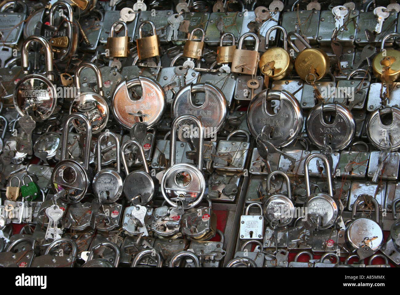 A variety of padlocks for sale on a street stall in Jaipur, India. Stock Photo