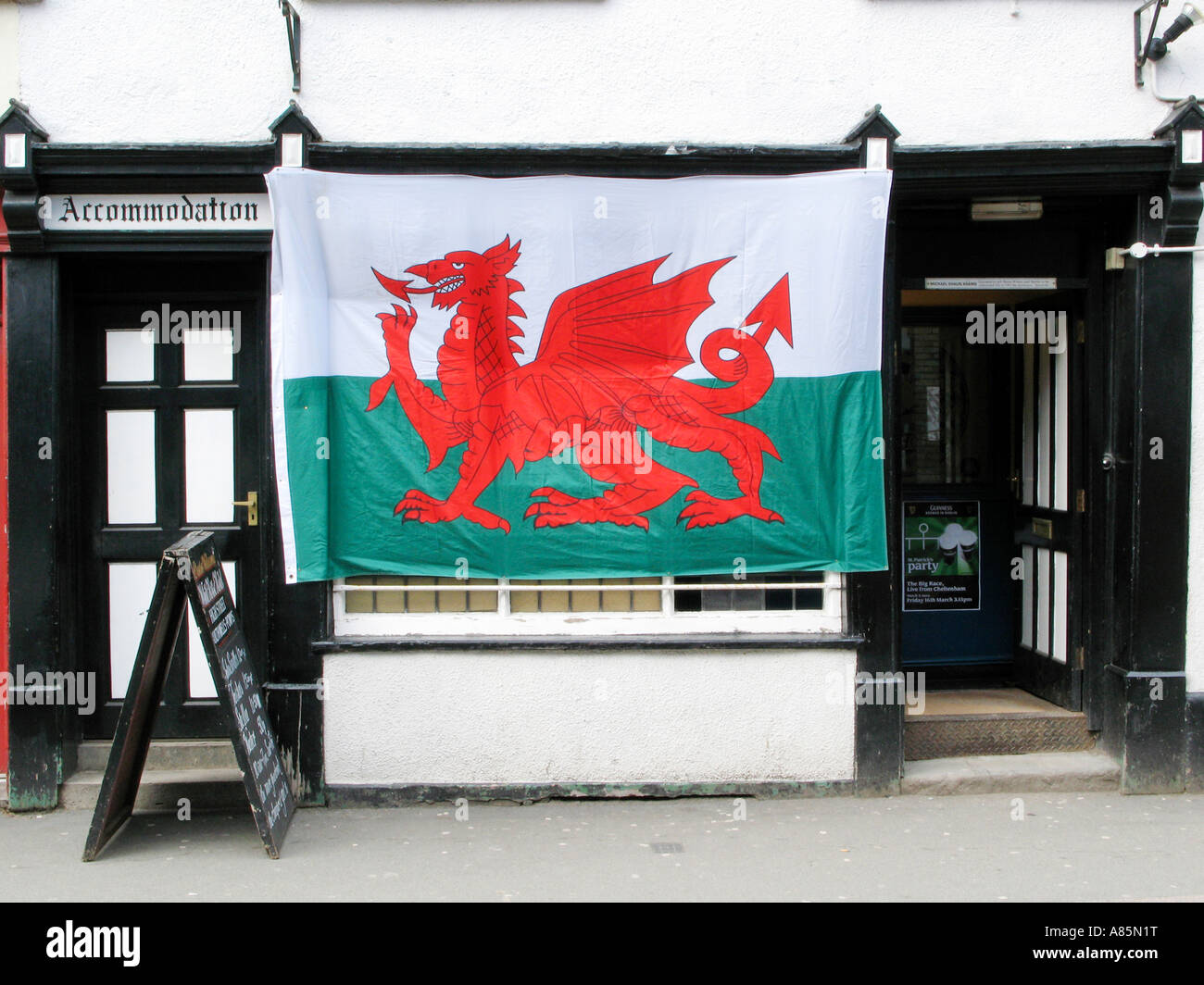 Welsh flag THE WHITE HORSE public house in Builth Wells Powys Mid-Wales UK with national flag on St Davids Day Stock Photo