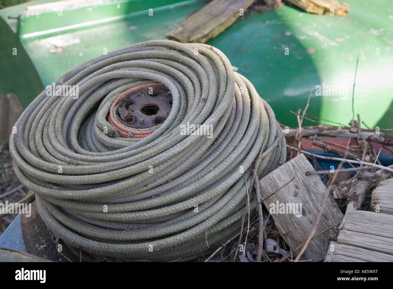 Coil of blue ageing rope Stock Photo - Alamy