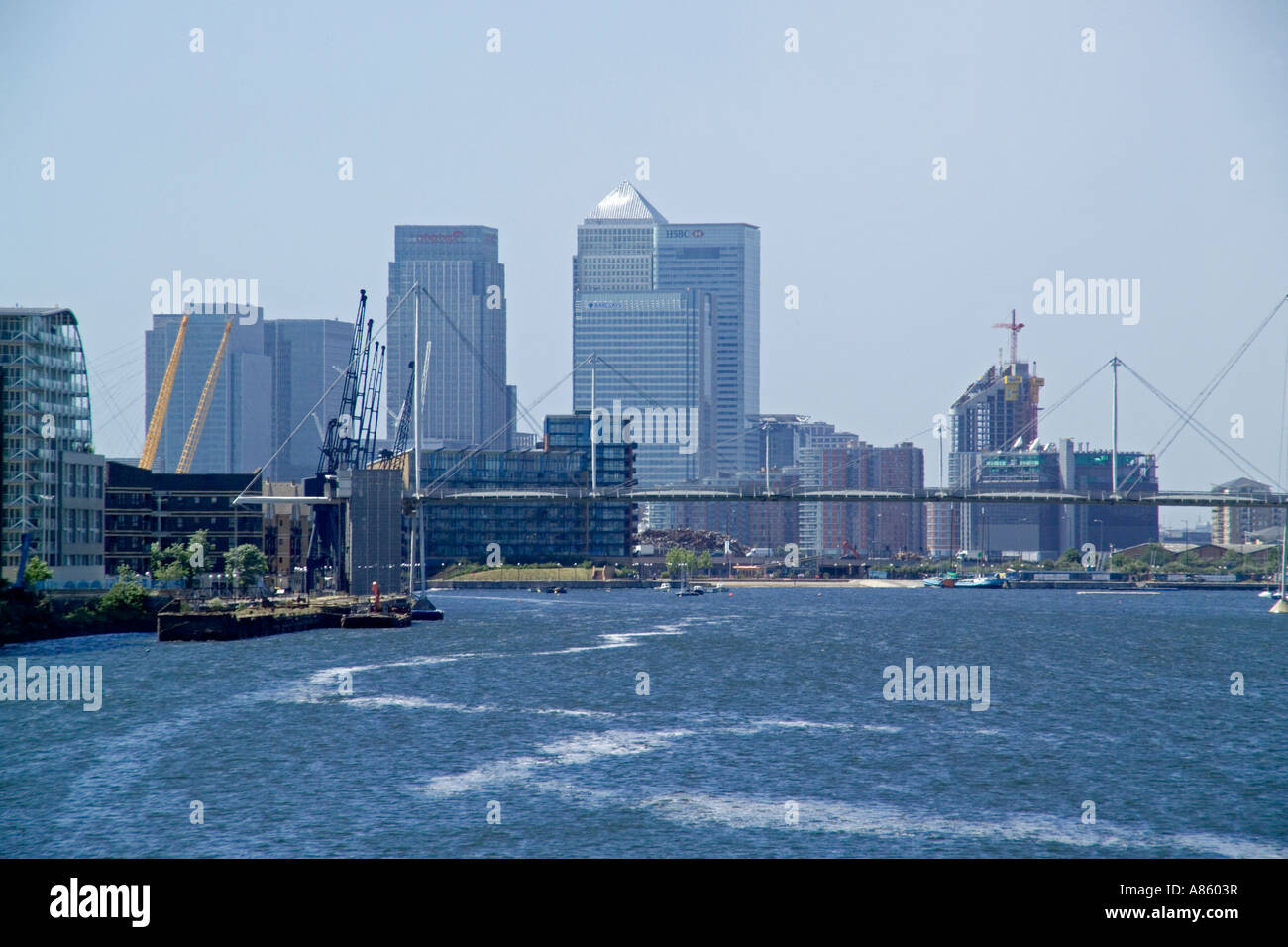 Canary wharf over Docklands basin Stock Photo - Alamy