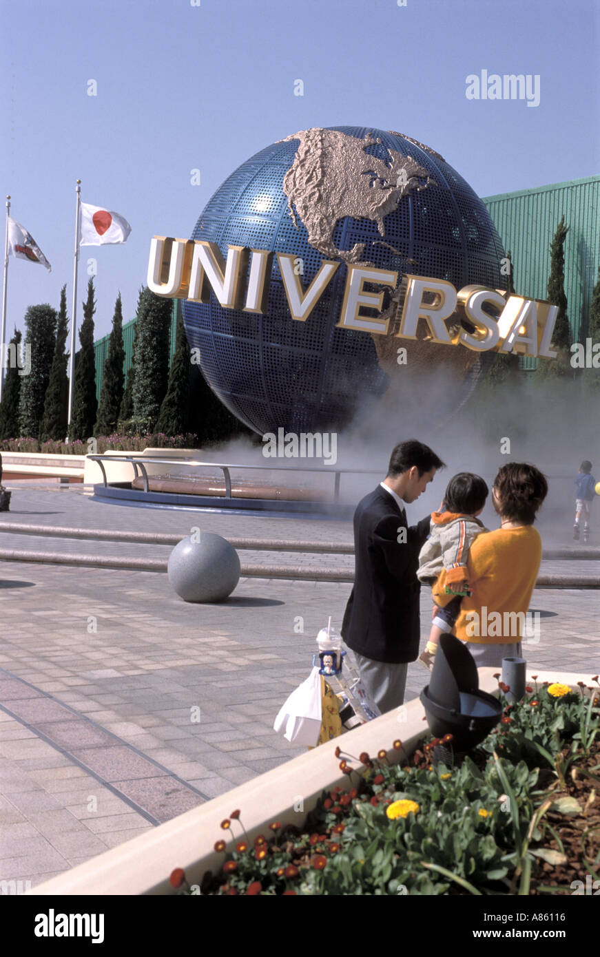 A family spends a day enjoying the sights at the Universal Studios Japan theme park in Osaka Stock Photo