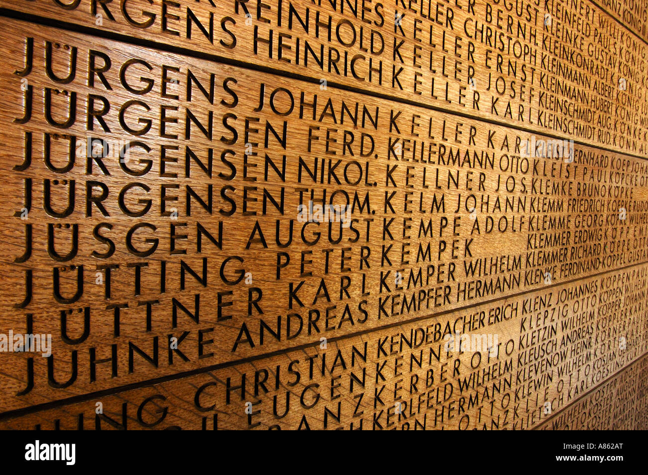 Names of soldiers carved in oak in the German war cemetery at Langemark, Belgium. Stock Photo