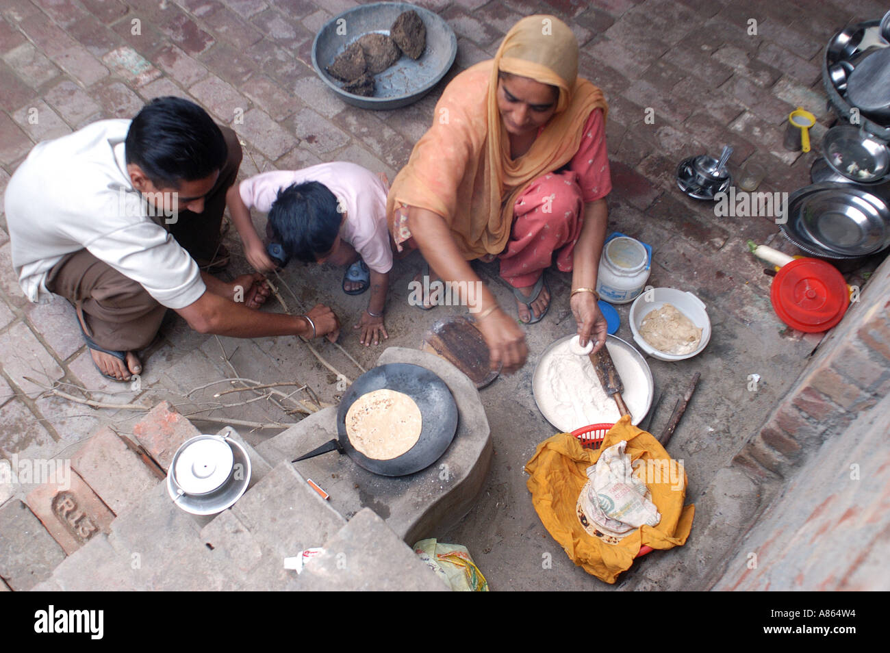 Punjabi woman cooking in the open kitchen, Amritsar, Punjab, India