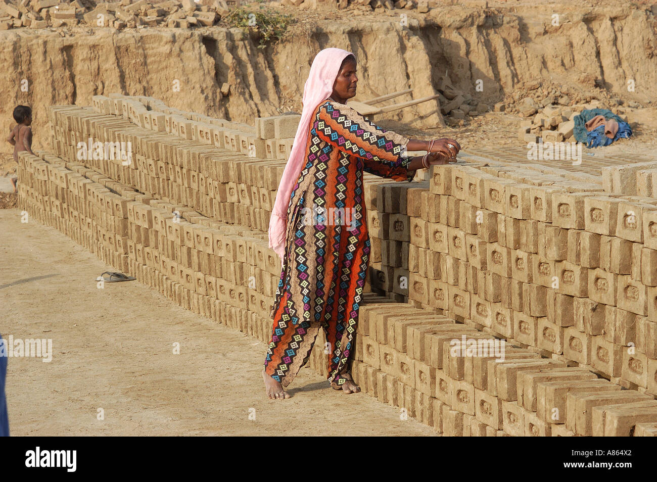 indian woman arranging bricks at local kiln in Amritsar district Punjab India Stock Photo