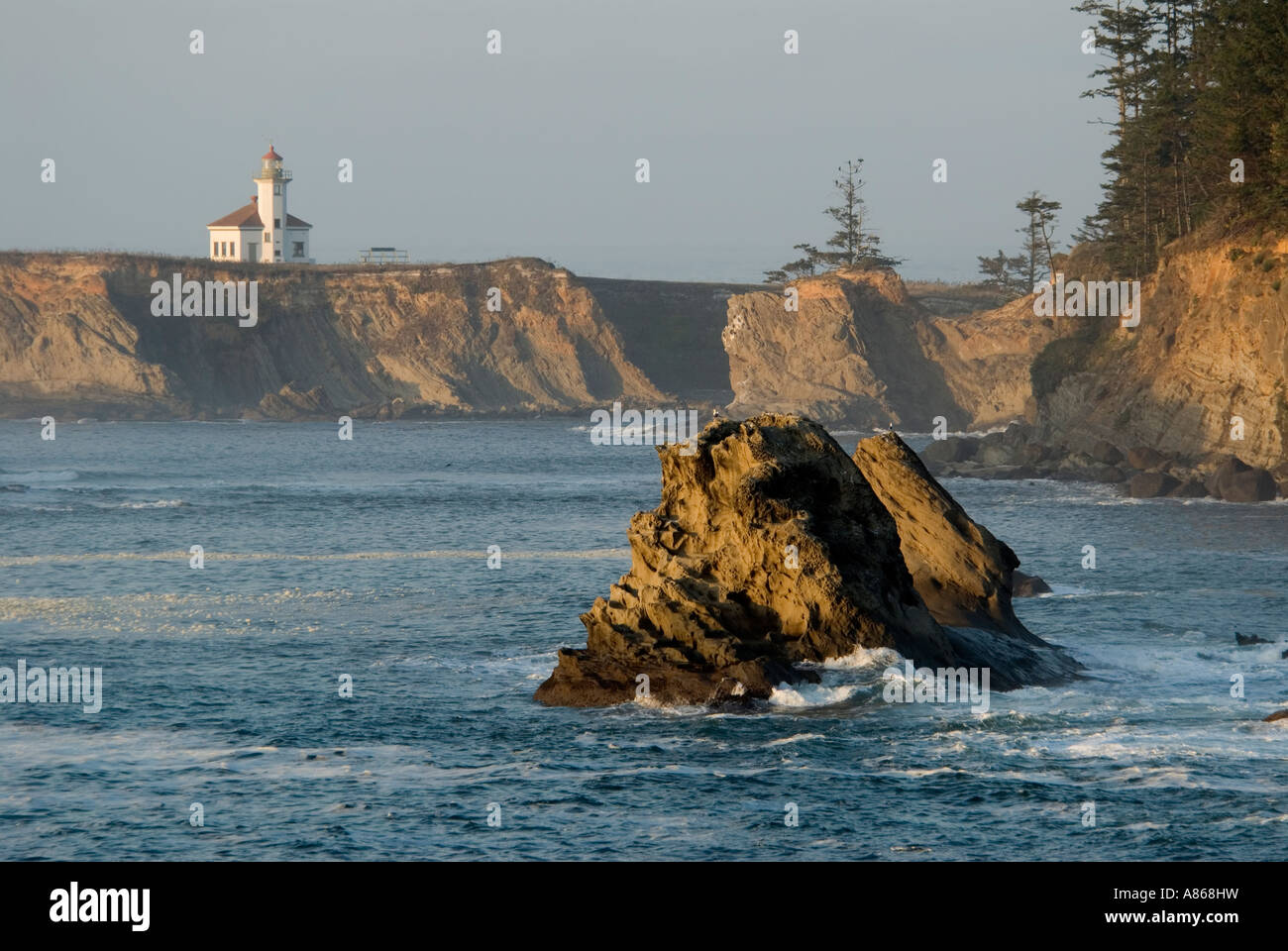 Cape Arago Lighthouse overlooking Sunset cove near Charleston, Oregon in the United States of America. Stock Photo