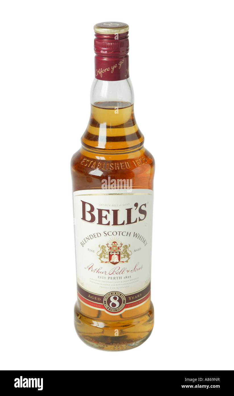 Bells 8 year old whiskey on studio white background showing yellow whiskey color through glass Stock Photo