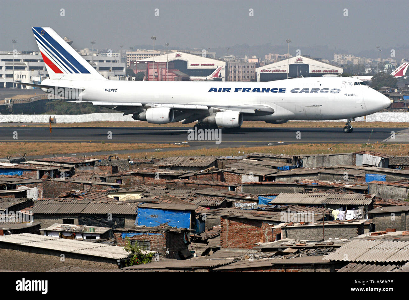 Air France cargo aeroplane and slums of Bombay airport,  Mumbai , India Stock Photo