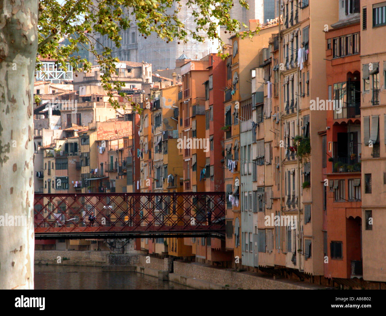 Multi colour high concentration of residential buildings overlooking river Onyar in Girona Spain Stock Photo